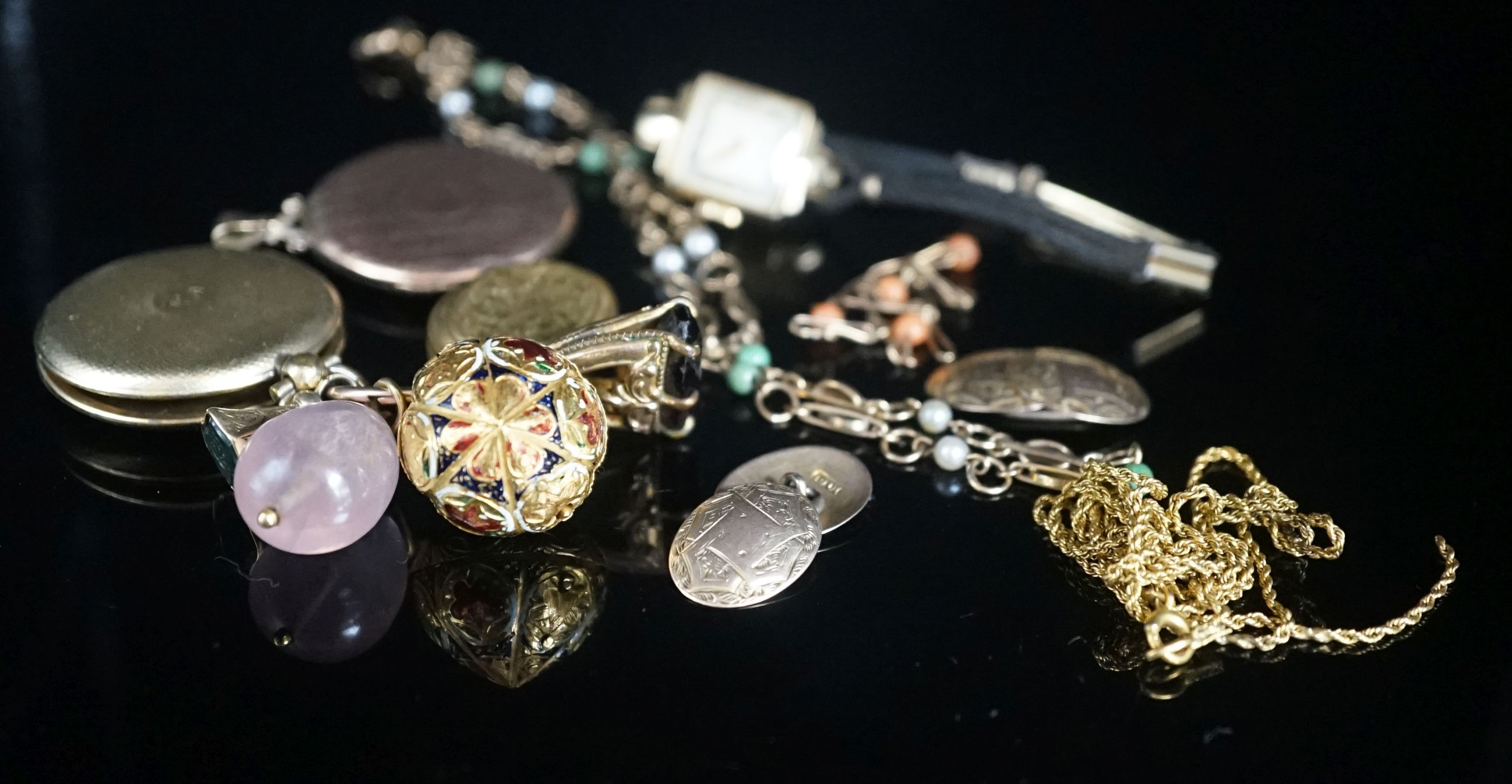 A group of mixed jewellery a pair of 10ct cufflinks, assorted fobs, a 9ct ropetwist chain(a.f.), a 9ct necklace, a 9ct gold small bracelet, wrist watch, locket etc.